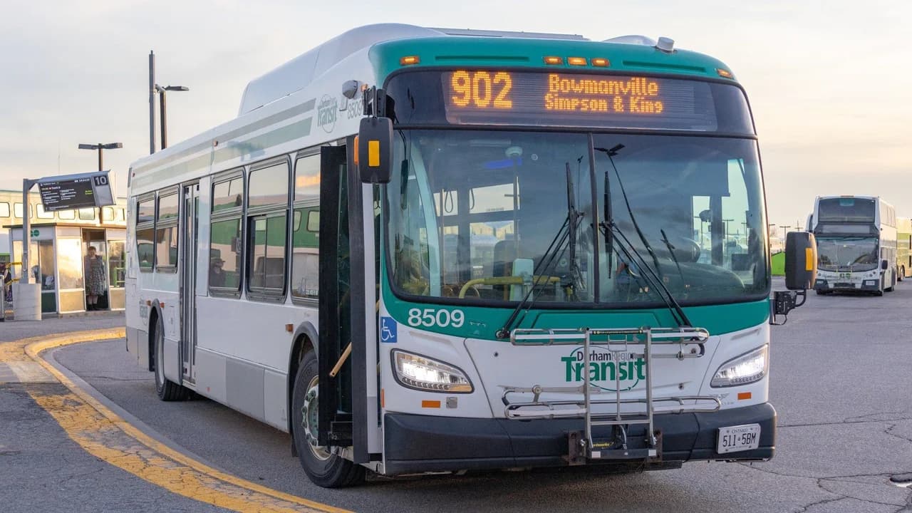 Durham Region Transit bus 8509, on route 902, boarding at the Oshawa GO station bus loop.
